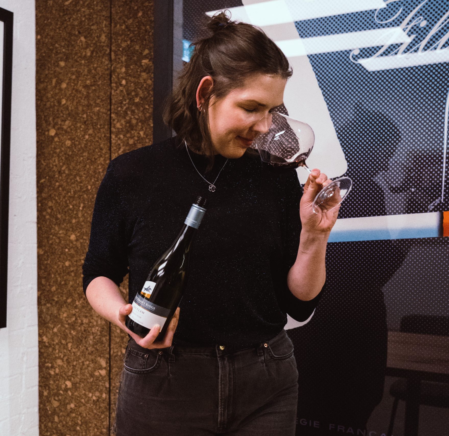 Lisa tasting a pinot noir