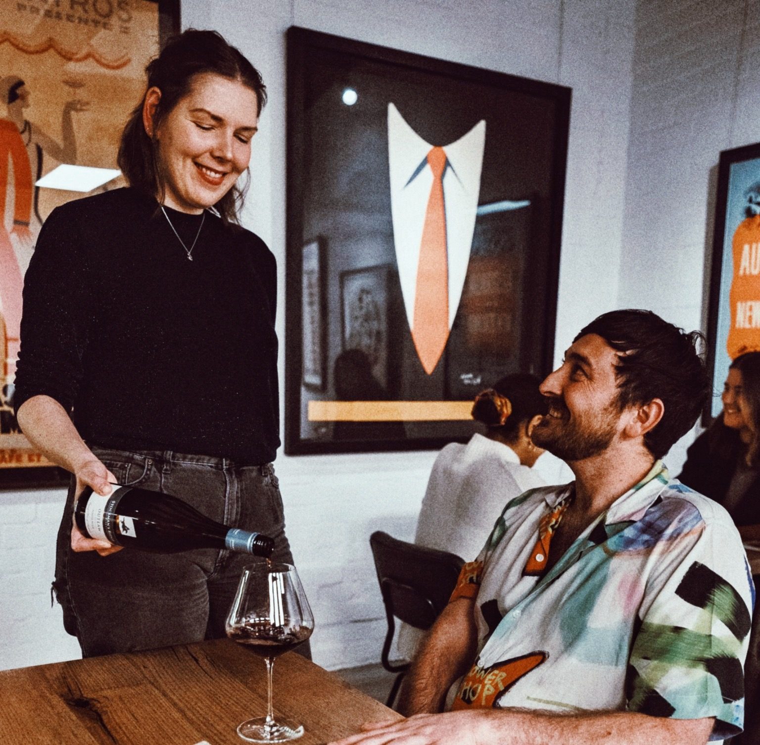 Opening a bottle at the table