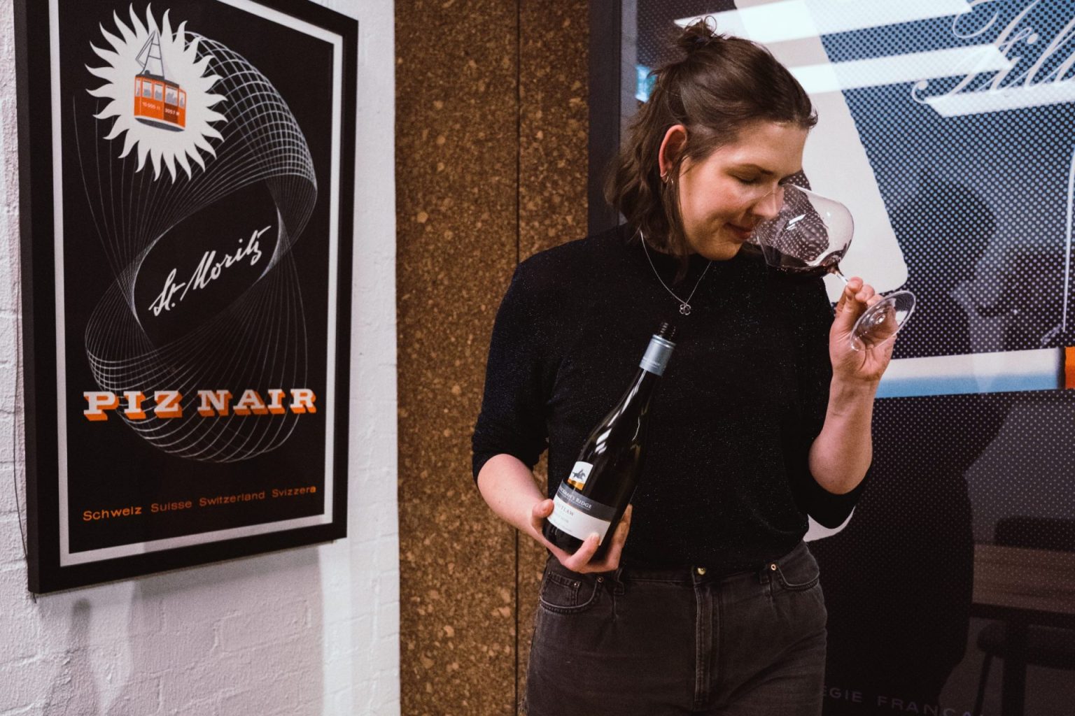 Tasting a bottle at the poster wall