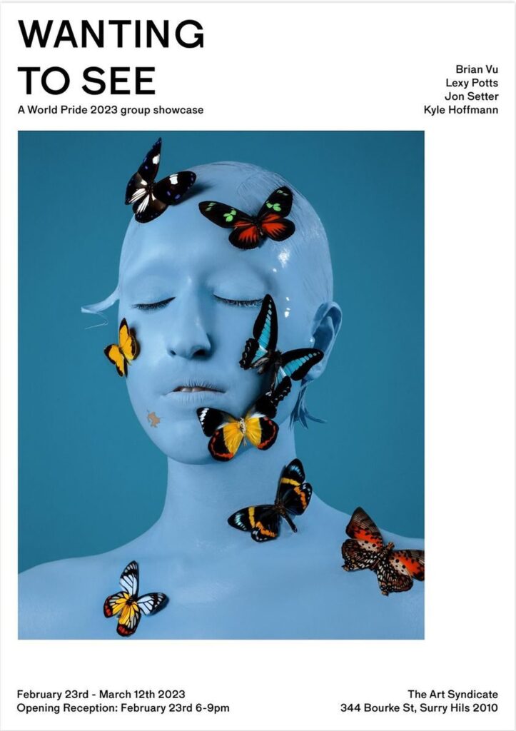 Exhibition poster: a blue-painted figure covered in butterflies